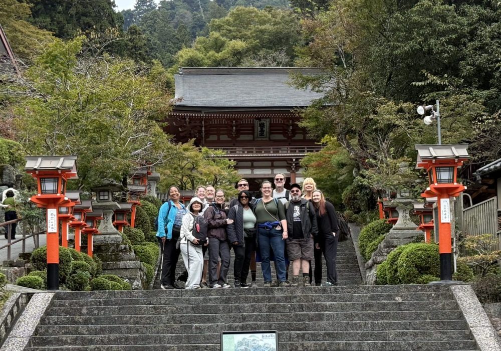 Photo showing Reiki students on the Steps in front of Mount Kurama on a Reiki pilgrimage to the mountain with Brian Brunius and Christopher Tellez of Koshin Reiki.